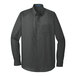 A graphite Port Authority long sleeve button down dress shirt.