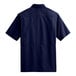 A back view of a navy Port Authority short sleeve Daybreak shirt.