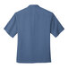A Port Authority blue short sleeve shirt.