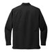 A back view of a black Port Authority long sleeve shirt.