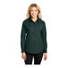 A woman wearing a Port Authority dark green long sleeve dress shirt.