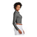 A woman wearing a Brooks Brothers black long sleeve dress shirt.