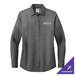 A long sleeved black Brooks Brothers dress shirt on a counter.