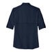 A back view of a navy blue short sleeve Port Authority shirt.