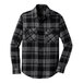 A long sleeved Port Authority black and grey plaid flannel shirt.