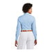A woman wearing a blue Brooks Brothers Newport dress shirt.