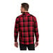 A man wearing a Port Authority red and black plaid flannel shirt.