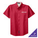 A red Port Authority short sleeve dress shirt with a white logo.