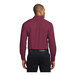 A man wearing a Port Authority burgundy and light stone long sleeve dress shirt.