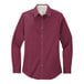 A Port Authority burgundy long sleeve dress shirt for women in a white background.
