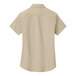 A tan Port Authority short sleeved dress shirt.