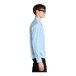 A person wearing a light blue Mercer+Mettle dress shirt.