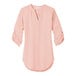 A rose quartz Port Authority blouse with rolled short sleeves and a v-neck.