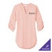 A rose quartz tunic blouse with 3/4 sleeves and white text reading "Women's" on it.