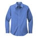 A Port Authority women's long sleeve blue poplin shirt.