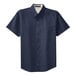 A Port Authority navy and light stone short sleeve button-down dress shirt.