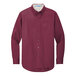 A Port Authority long sleeved burgundy and light stone dress shirt.