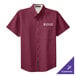A close-up of a burgundy and light stone short sleeve Port Authority dress shirt.