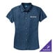 A Port & Company women's ink blue denim button-down shirt with a white logo on the front.
