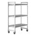 A white plastic Camshelving drying rack cart with shelves and wheels.