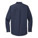 A Port Authority navy and light stone long sleeve dress shirt with a blue background.