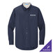A navy Port Authority long sleeve dress shirt.