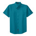 A teal green Port Authority short sleeve button-up dress shirt with a button-up front.