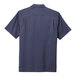 A back view of a Port Authority unisex true navy short sleeve performance staff shirt.