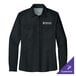 A Port Authority women's long sleeve black shirt with a logo on the counter.