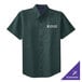 A dark green Port Authority short sleeve dress shirt with a logo on it.