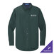 A dark green Port Authority long sleeve dress shirt with a logo on the chest.