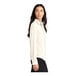 A woman wearing a Mercer+Mettle ivory chiffon camp blouse with long sleeves.