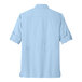 The back view of a light blue Port Authority long sleeve shirt.
