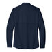 A Port Authority navy short sleeve shirt.