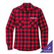 A red and black plaid Port Authority long sleeve flannel shirt on a table.