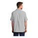 A man wearing a Port Authority short sleeve moisture wicking shirt in gray.