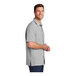 A man in a grey Port Authority short sleeve performance shirt.