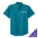 A teal Port Authority button-up shirt with white text on the front.