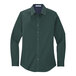 A dark green Port Authority ladies' long sleeve poplin shirt.
