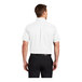 A man wearing a white Port Authority dress shirt.