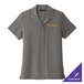 A Port Authority women's graphite short sleeve shirt with gold embroidery of a logo.