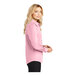 A woman wearing a Port Authority light pink long sleeve dress shirt.