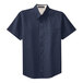 A Port Authority navy blue and light stone short sleeve button-down dress shirt.