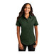 A woman wearing a Port Authority dark green short sleeve dress shirt.