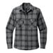 A Port Authority long sleeved flannel shirt in gray and black with a pocket.