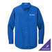 A Port Authority long sleeve blue dress shirt.