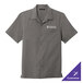 A Port Authority graphite short sleeve staff shirt with a logo on the chest.