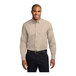 A man wearing a Port Authority long sleeved oxford shirt.