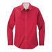 A red Port Authority long sleeve dress shirt for women in a white background.