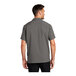 A man wearing a graphite Port Authority short sleeve staff shirt.